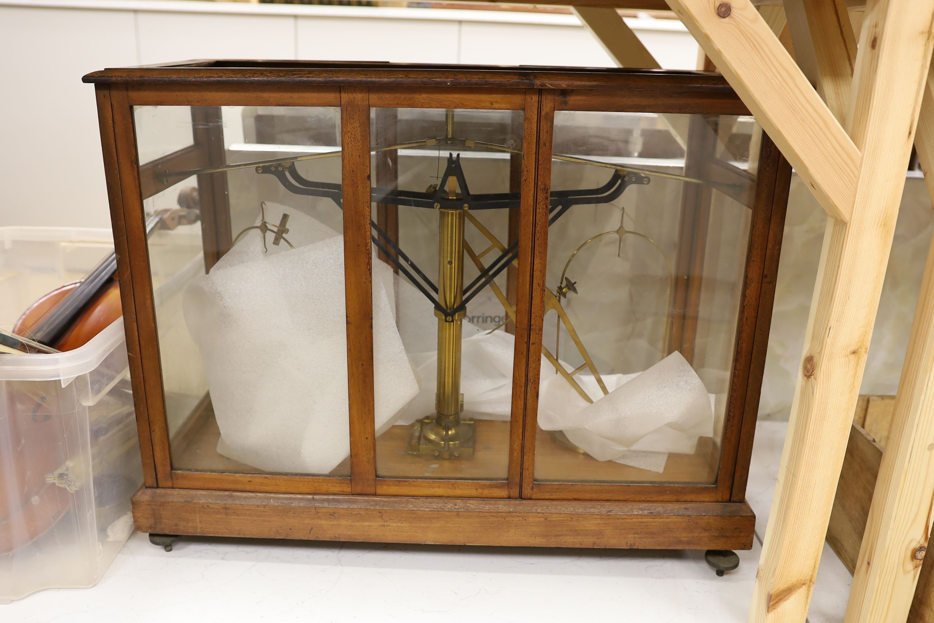 A large mahogany cased set of chemist's beam scales, 70 cms wide x 58 cms high.